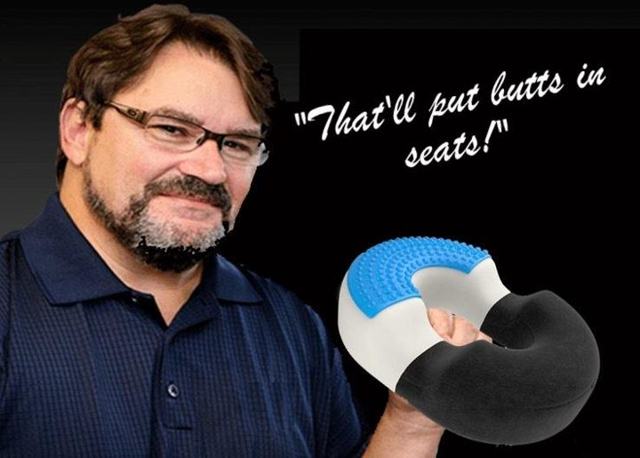 Tony Schiavone endorses “That’ll Put Butts in Seats” brand of hemorrhoid pillows