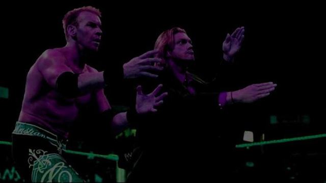 Fans without benefit of flash photography struggle to capture Edge & Christian reunion
