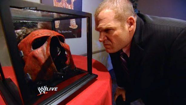 Kane shockingly removes, puts on, removes, puts on, removes mask