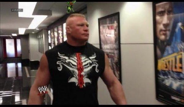 Lesnar lingers for awkwardly long time under mistletoe at WWE office Christmas party