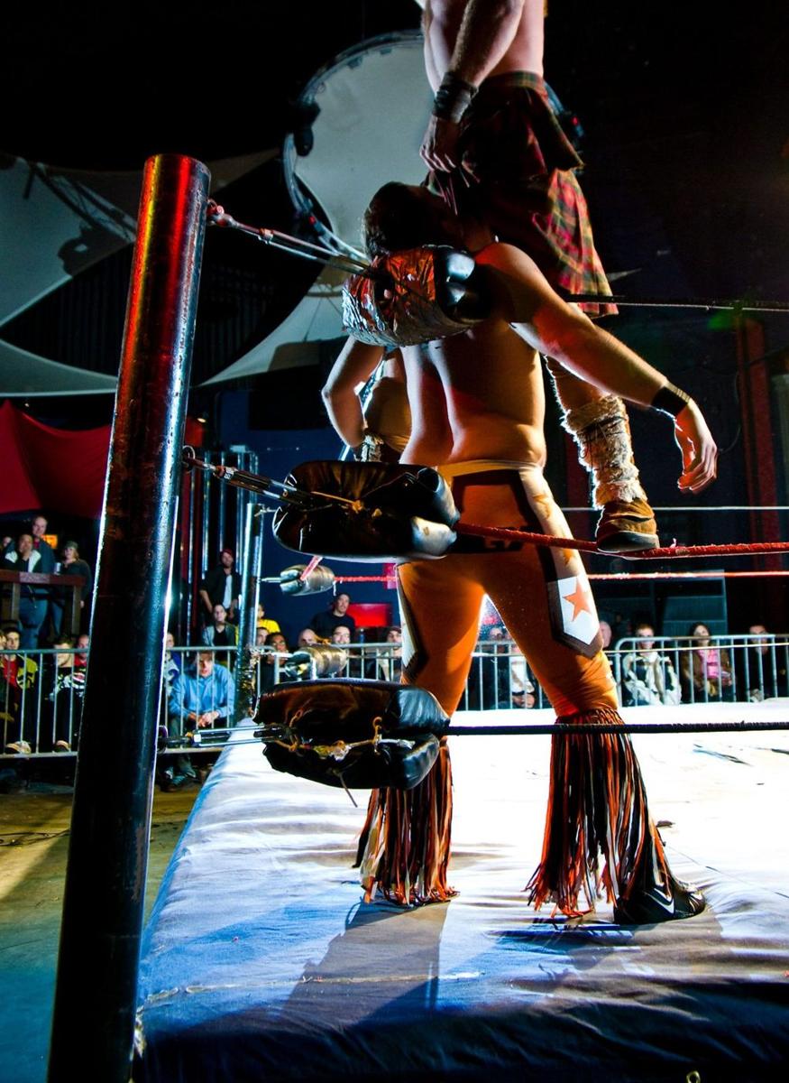 Pro wrestling match simultaneously homophobic and homoerotic