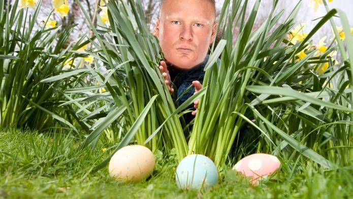 Lesnar gleefully searches for colorful eggs hidden around Heyman’s yard