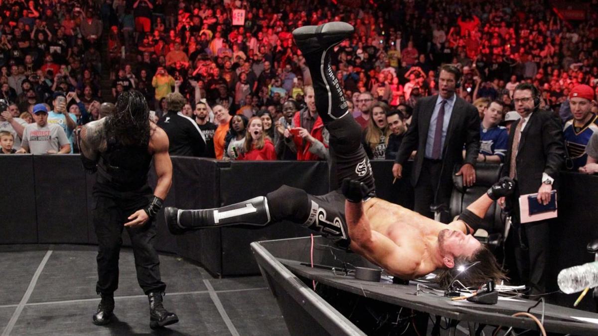 Courteous wrestler removes monitors from announce table before destroying it