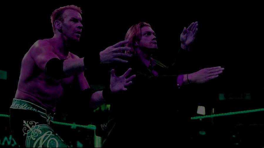 Fans without benefit of flash photography struggle to capture Edge & Christian reunion